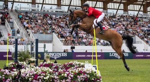Steve Guerdat of Switzerland on Albfuehren's Maddox tackles a water jump in the FEI Jumping Nations Cup of France at La Baule, France, June 11, 2021.