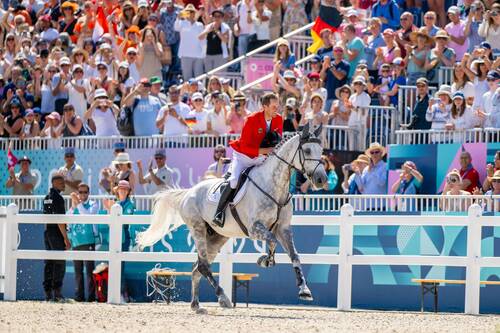 Paris 2024 Olympic GamesChristian Kukuk (GER) riding Checker 47 during the Lap of Honour after winning Gold in the Individual Show Jumping Final at the Chateau de Versailles for the Paris 2024 Olympic Games.Photo Credit: FEI/Benjamin Clark