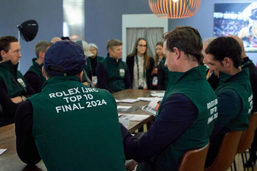 Around the table at the pre-Top 10 briefing as riders share moments of excitement and concentration.
