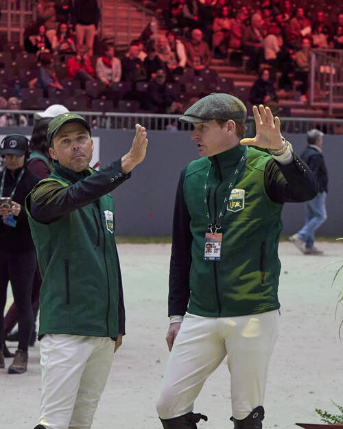 Kent Farrington and Daniel Coyle. Studying the course together, exchanging ideas, details, and final insights before taking on the challenge ahead.