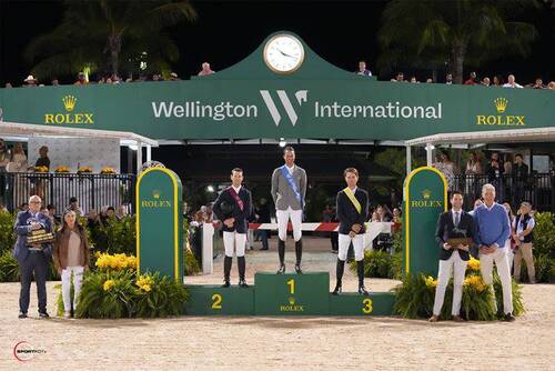 Christian Kukuk, Mclain Ward and Karl Cook in their podium presentation with Kyle Younghans, Sports Marketing Manager, Rolex Watch USA (second from right); Wellington International President Michael Stone (left); Marsha Dammerman (second from left) presenting the Dennis Dammerman Perpetual Trophy; and Ludger Beerbaum (right). Photo © Sportfot