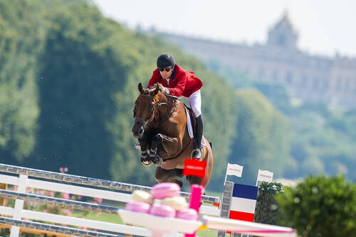 Karl Cook (USA) riding Caracole de la Roque during the Show Jumping Team - Qualifier at the Chateau de Versailles for the Paris 2024 Olympic Games.     Photo Credit: FEI/Benjamin Clark