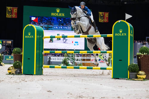 GENEVE, SWITZERLAND - DECEMBER 11 2022 : Martin FUCHS of Switzerland riding Leone Jei  at  - CHI de Geneve - Rolex Grand Prix  on December 11, 2022 in Geneve, .