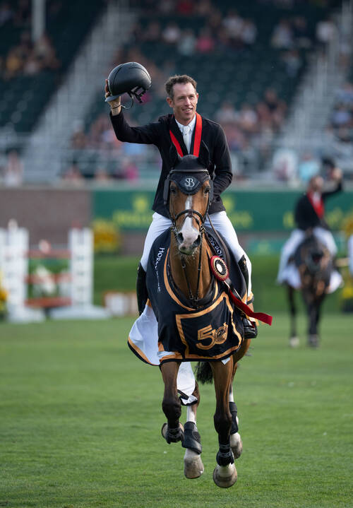 Scott Brash (GBR) riding Hello Jefferson walks a lap of honour as they celebrate winning the CPKC 'International' Grand Prix, presented by Rolex