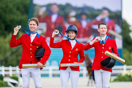 Show Jumping Team Silver Medalists - USA     L-R: Karl Cook, Laura Kraut and McLain Ward at the Chateau de Versailles for the Paris 2024 Olympic Games.     Photo Credit: FEI/Benjamin Clark
