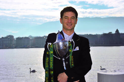 Steve Guerdat with the Rolex IJRC Top Ten Trophy at the edge of Lake Geneva